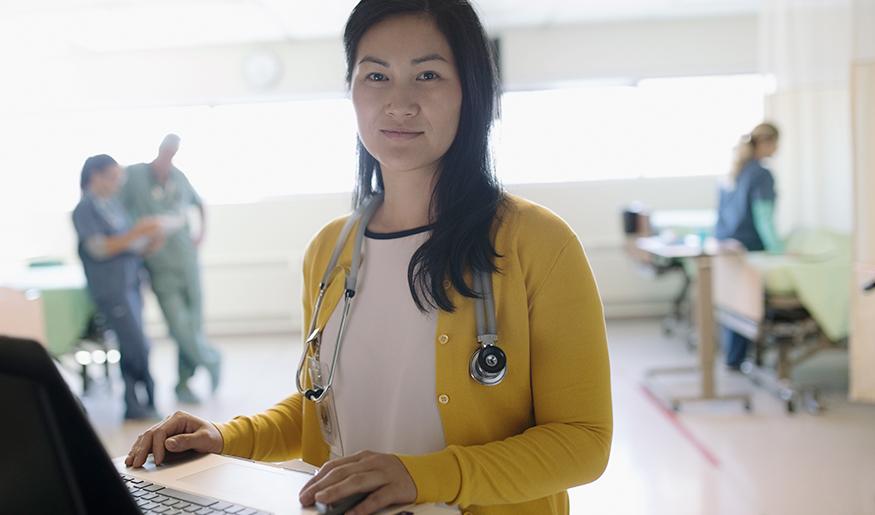 Health care worker at computer